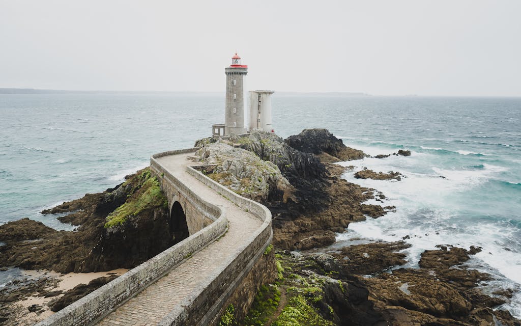Explore the scenic beauty of Phare du Petit Minou lighthouse on Bretagne's rugged shore.