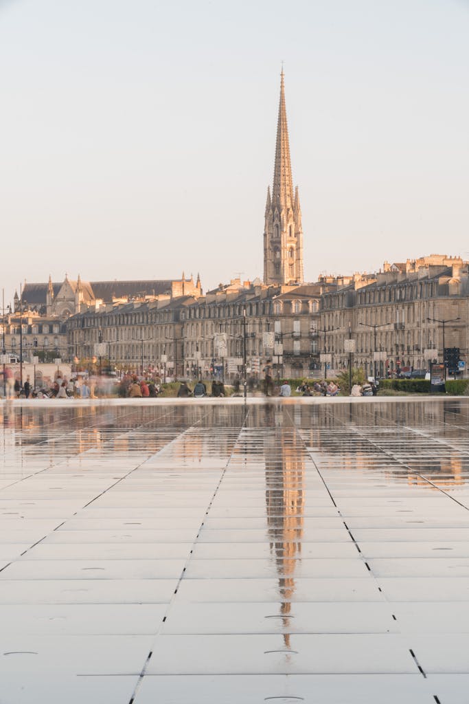 Scenic view of Bordeaux architecture reflecting in water at daylight.